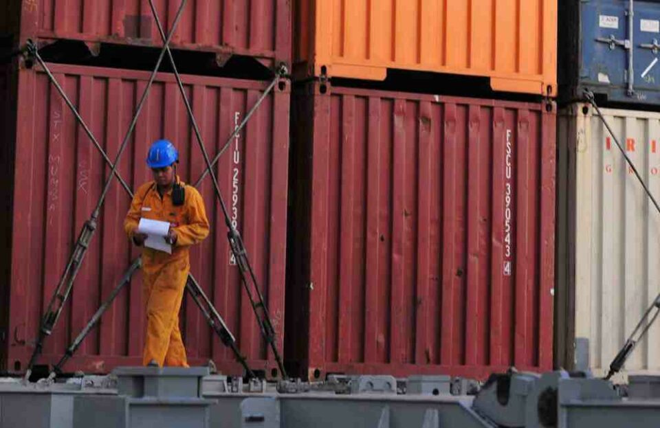 Man walking in front of storage containers at a rented facility in need of landlord insurance