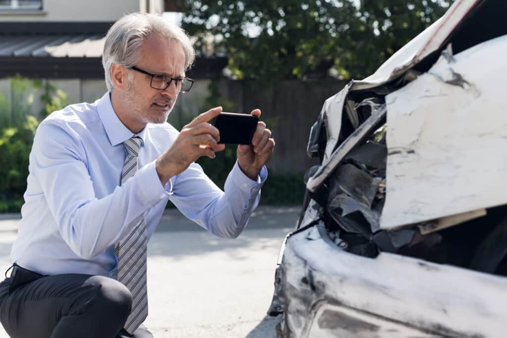 taking a photo of a car accident for an insurance claim