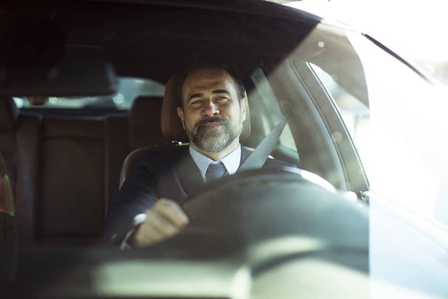 Auto Insurance - Businessman Driving