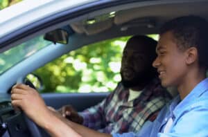 Father Teaching Son Too Drive