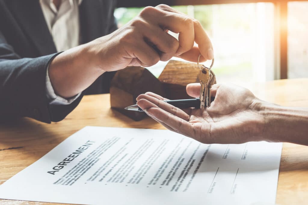 Signing a rental agreement that includes a security deposit.